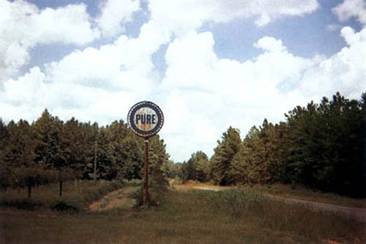 Pure Oil Sign in Landscape, near Marion, Alabama, 1977, Digital pigment print on Hahnemuhle paper
